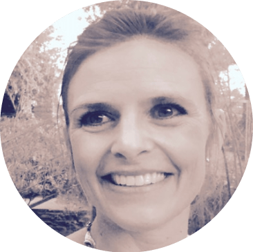 Photo of Tracy Heverly, a smiling Caucasian woman with her hair pulled back. 