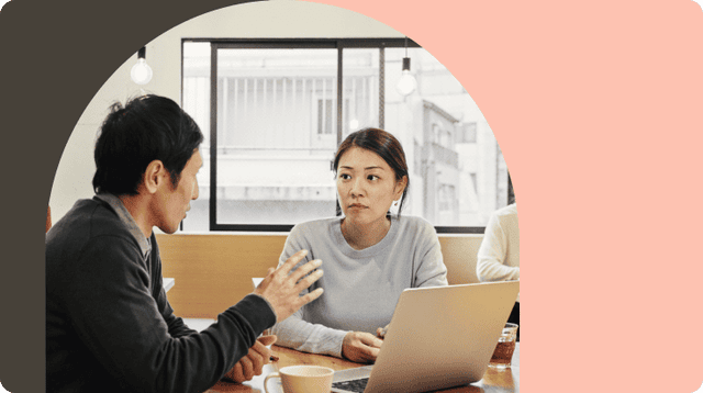 Two individuals are engaged in a conversation