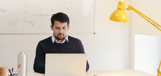 photo of a person working at a desk